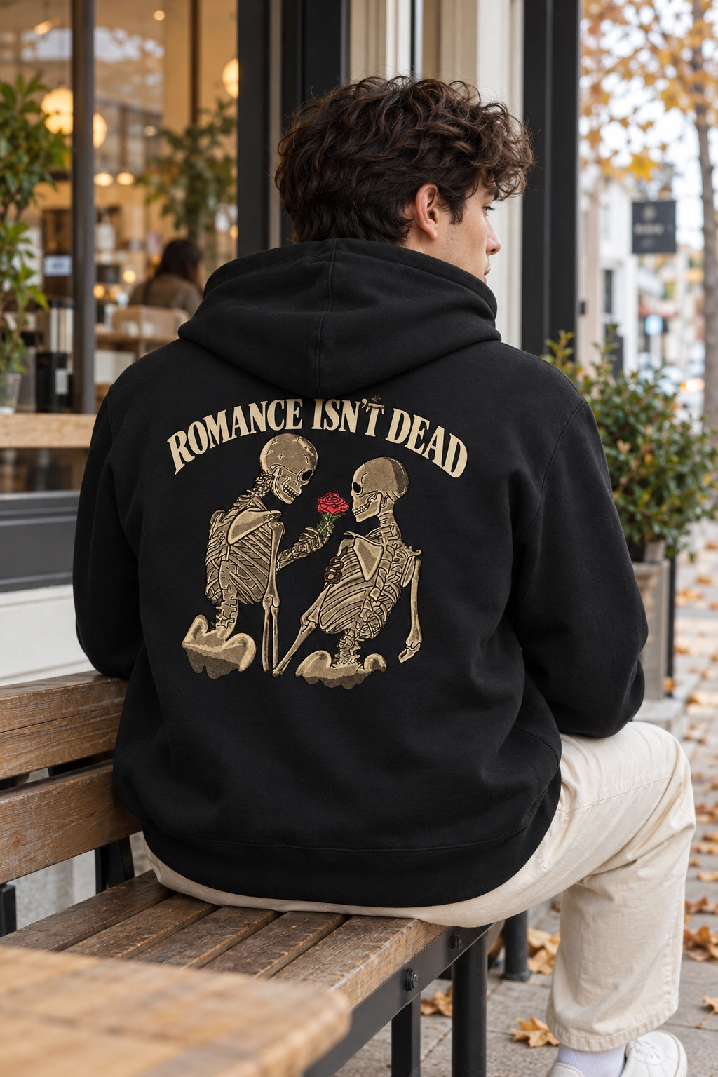 Romance Isn't Dead Black hoodie, back print with two skeletons and a red rose